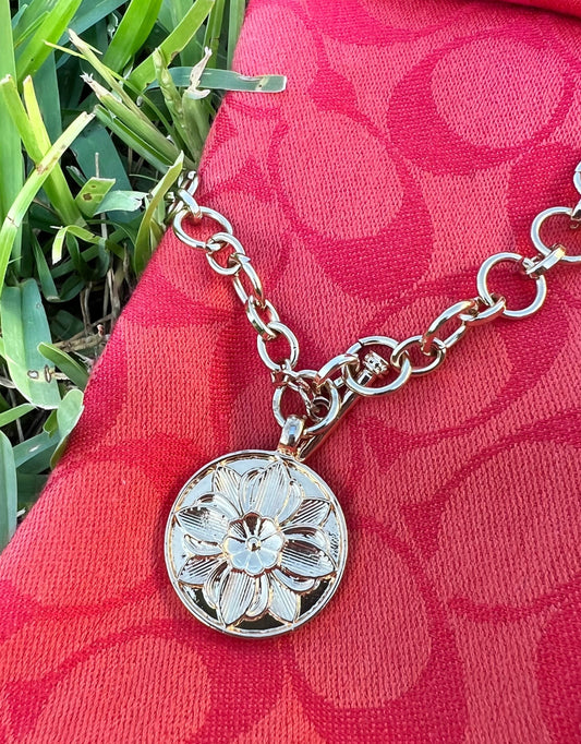 Gold chain with flower medallion