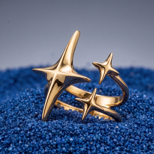 Gold star-shaped ring on a blue textured surface